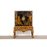 A BLACK JAPANNED CABINET ON GILTWOOD STAND