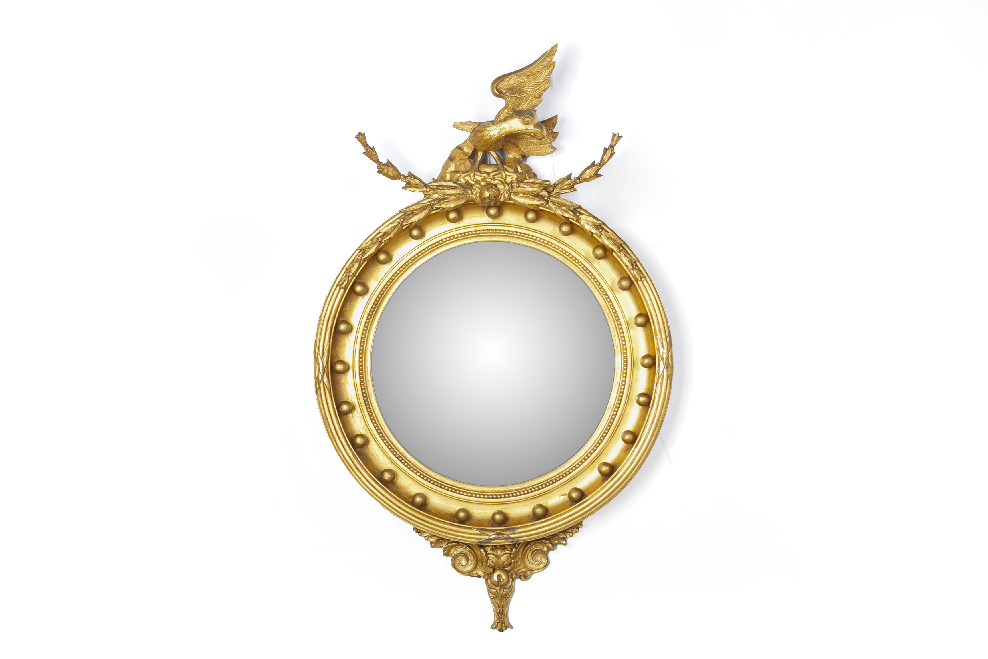 A REGENCY GILT CONVEX WALL MIRROR