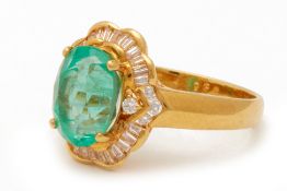 AN EMERALD AND DIAMOND RING