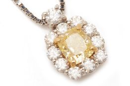 A YELLOW AND WHITE DIAMOND PENDANT ON CHAIN