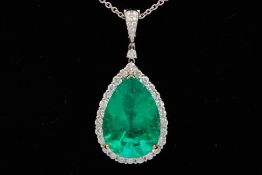 A LARGE EMERALD AND DIAMOND PENDANT ON CHAIN