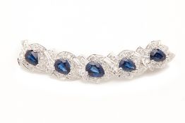 A BLUE SAPPHIRE AND DIAMOND BROOCH