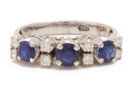 A SAPPHIRE AND DIAMOND RING