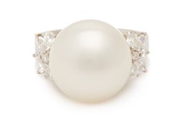 A LARGE CULTURED PEARL AND DIAMOND RING