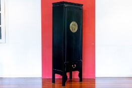 A SLIM CHINESE BLACK LACQUER CABINET