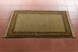 A WOOL RUG WITH BOTEH DESIGN