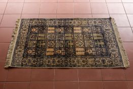 A SMALL SILK PANEL RUG