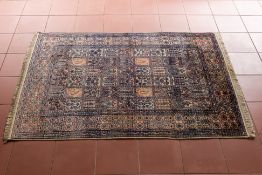 A PANELLED GARDEN DESIGN RUG