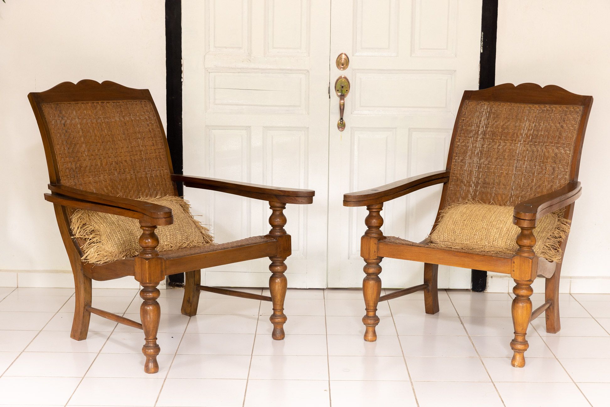 A PAIR OF TEAK PLANTERS CHAIRS