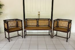 A SET OF THREE ANGLO INDIAN CANED CHAIRS AND SETTEE