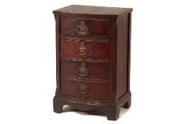 A SMALL BEDSIDE CHEST OF DRAWERS