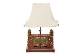 AN INDONESIAN CARVED TABLE LAMP