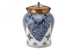 A BRONZE MOUNTED BLUE AND WHITE JAR AND COVER