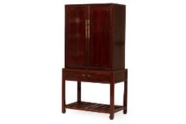 A CHINESE CABINET ON STAND