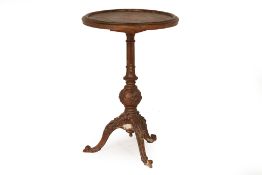 AN ANTIQUE CIRCULAR TRIPOD TABLE WITH PAINTED TOP