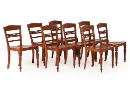 A SET OF EIGHT TEAK DINING CHAIRS