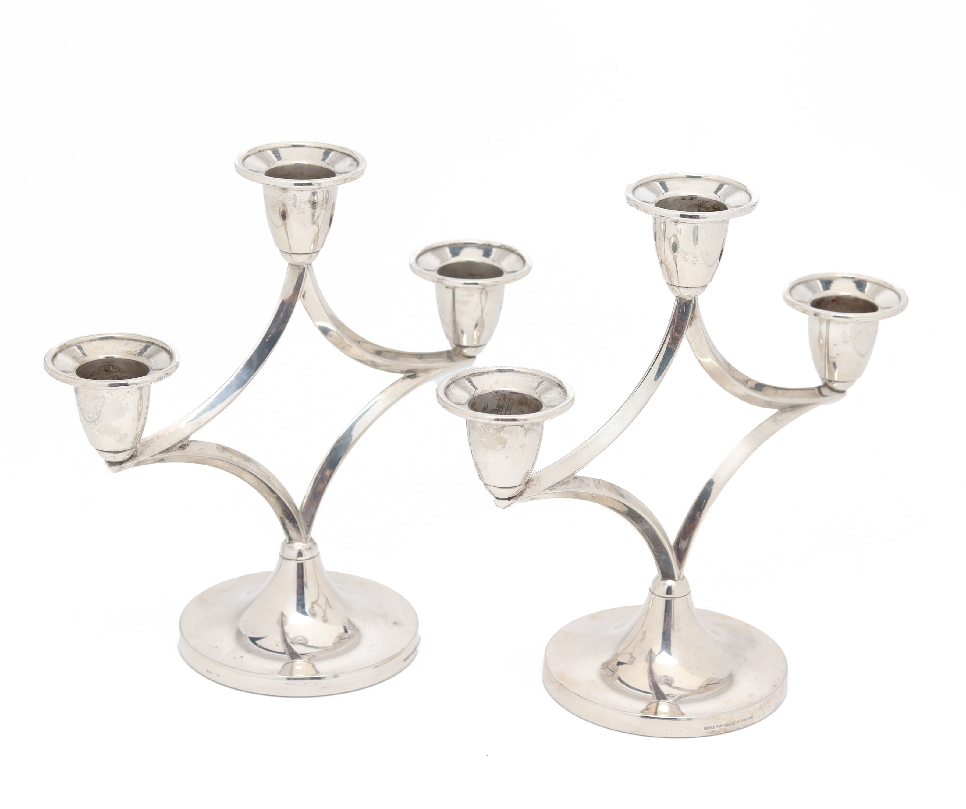 A PAIR OF ENGLISH SILVER PLATED THREE LIGHT CANDELABRA