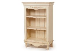 A WHITE PAINTED BOOKCASE
