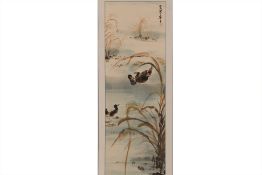 A CHINESE HANGING SCROLL OF DUCKS IN A POND