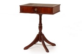 A SMALL OCCASIONAL TABLE WITH LEATHER INLAID TOP