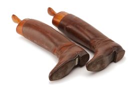 A PAIR OF BROWN LEATHER RIDING BOOTS