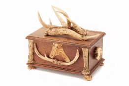 AN ANTLER MOUNTED OAK BOX