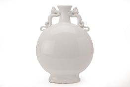 A LARGE WHITE GLAZED PORCELAIN MOON FLASK AND A VASE