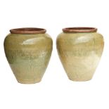 A PAIR OF LARGE OLIVE GREEN GLAZED POTS