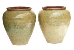 A PAIR OF LARGE OLIVE GREEN GLAZED POTS