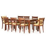 A DINING TABLE AND TEN CHAIRS