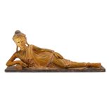 A SOUTHEAST ASIAN GILTWOOD RECLINING BUDDHA