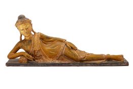 A SOUTHEAST ASIAN GILTWOOD RECLINING BUDDHA