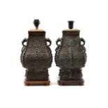 A PAIR OF ARCHAIC CHINESE STYLE TABLE LAMPS