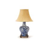 A BLUE AND WHITE VASE MOUNTED AS A TABLE LAMP
