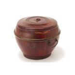 A TWIN HANDLED RED LACQUER CONTAINER