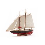 A RUSTIC HANDMADE WOODEN MODEL OF A SAILING BOAT