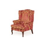 A WINGBACK ARMCHAIR WITH DESIGNERS GUILD FABRIC