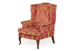 A WINGBACK ARMCHAIR WITH DESIGNERS GUILD FABRIC