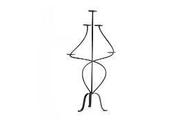 A WROUGHT IRON FLOOR STANDING CANDLE HOLDER