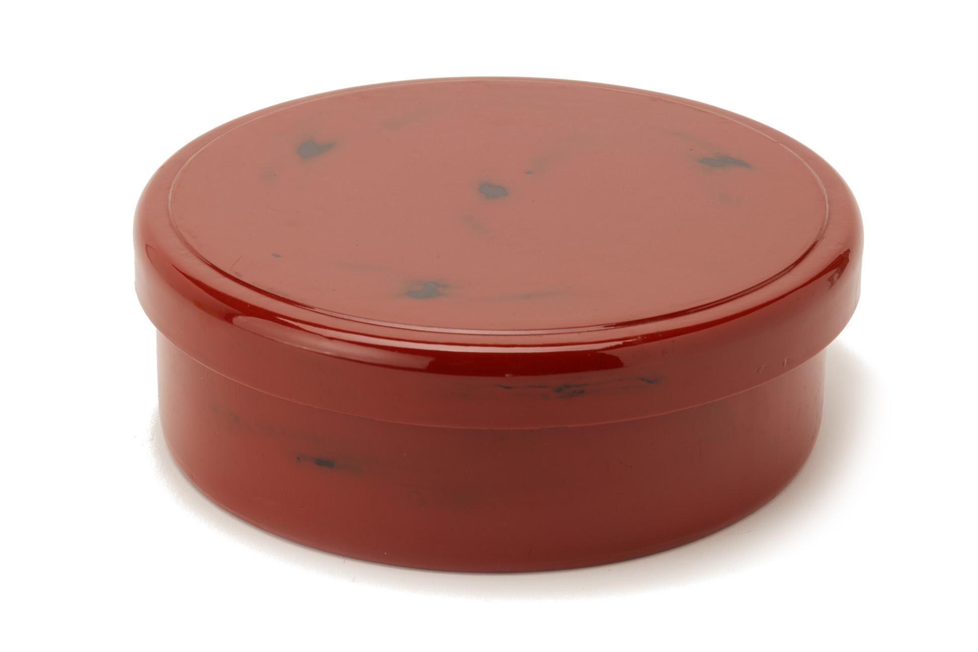 A RED LACQUER CIRCULAR BOX AND COVER