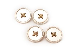 A PAIR OF TIFFANY & CO. SILVER AND GOLD BUTTON CUFFLINKS