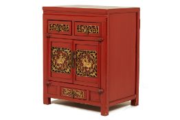 A CHINESE RED LACQUERED CABINET