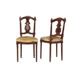 A PAIR OF UPHOLSTERED SIDE CHAIRS