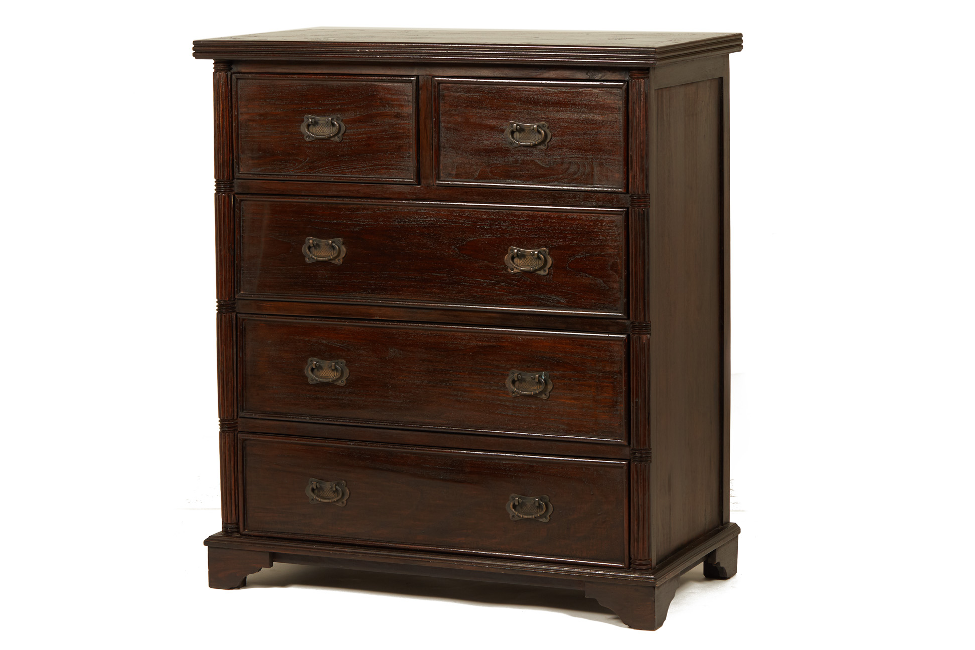 A TEAK CHEST OF DRAWERS