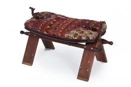 A CAMEL SADDLE STOOL