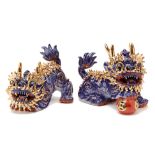 A PAIR OF ORIENTAL PORCELAIN MYTHICAL BEASTS