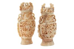 A PAIR OF CHINESE CARVED HARDSTONE VASES AND COVERS