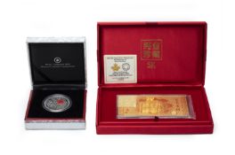 A COMMEMORATIVE COIN AND GOLD BAR