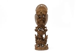 A BALINESE CARVED WOOD SCULPTURE