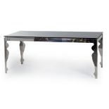 A CONTEMPORARY STEEL AND GLASS DINING TABLE